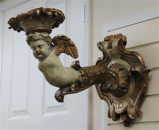 A pair of 19th century Italian carved and painted parcel gilt wall scones, 20in.